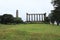 National Monument and Nelsons Monument on Calton hill, mountain in Edinburgh in east of Scotland