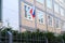 National red, blue, white flag of state of Russian Federation on silk on facade of building of Consulate General of Russia,