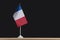 National table flag of France, black background. Space for text