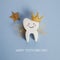National Tooth Fairy Day. Children tooth fairy. Cute tooth with wings, a crown and a magic wand.
