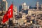 National Turkish flag on pole on background with Istanbul cityscape