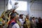 Native American Indian wearing a porcupine roach and a traditional outfit dancing at a powwow in San Francisco, USA