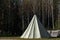 Native American wigwam in the forest. Modern material for the manufacture of wigwam. Yurt is the home of the northern peoples