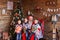 Native brothers boys sing Christmas carols to Santa Claus in roo