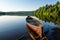 native canoe docked on the serene lake shore