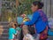 Native Mexican woman and child selling dolls in the streets of San Miguel de Allende