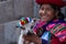 Native Peruvian holding a baby lamb