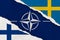 NATO, Finland and Sweden flag ripped paper grunge background. Abstract NATO membership, politics conflicts, war concept texture