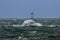 NATO military ship at sea during a storm