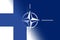 NATO-OTAN. Finland. NATO flag. Finland flag. Flag with the NATO logo. Concept of annexation of Finland with NATO-OTAN. Foreground.