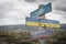 nato, ukraine and russia flag on signpost outdoors