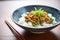 natto atop a bed of steamed white rice in a bowl