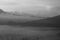 Natural abstract art background in black and white. Misty morning nature view in the mountains. Spirituality backgrounds.