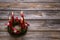 Natural advent wreath with four red candles on wooden background