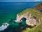 The natural arch known as The Wishing Arch on the Antrim Coast, near Giant`s Causeway, in Northern Ireland, UK.