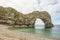 Natural arch in rock formation called durdle door in South England