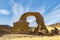 Natural arch shaped rock in Tadrart Rouge, Algeria.