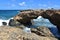 Natural Arched Lava Rock Bridge on the Coast