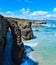 Natural arches on beach.