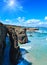 Natural arches on beach.