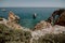 Natural arches of Praia da Marinha in Algarve, Portugal, Europe. Sunbeams over Marinha Beach one of the 100 most beautiful beaches