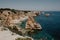 Natural arches of Praia da Marinha in Algarve, Portugal, Europe. Sunbeams over Marinha Beach one of the 100 most beautiful beaches