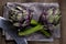 Natural artichokes on a rustic wooden table close up