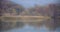 Natural background autumn lake with fluctuating water with reflections