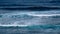 Natural background with blue tints of oceanic waves