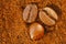 Natural background with coffee motif. Coffee bean and ground coffee zoomed in.Part of the frame out of focus, blurred for