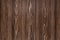 Natural background from larch boards. Textured wood surface. Dark brown color