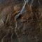 A natural background made of multi-colored wild stone close-up. View from above