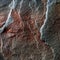 A natural background made of multi-colored wild stone close-up. View from above