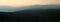 Natural background panorama background of scenic hilly landscape at dusk