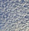 Natural background - white fluffy stratocumulus clouds on blue sky