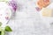 Natural bath salt, soap, cotton towel and lilac flowers symbolic image