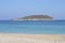 Natural beach seascape. Beach with fine sand and an islet