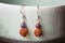 Natural beads earrings on pottery