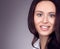 Natural beauty. Closeup portrait of a young woman. Neutral gray background