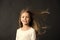 Natural beauty. Girl kid long hair flying in air, black background. Child with natural beautiful healthy hair. Quick