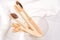 Natural biodegradable eco-friendly wooden toothbrushes with BPA free bristles in glass at white table