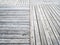 Natural bleached planks of wooden pavement on pier