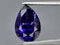 natural blue iolite gem on the background