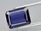 natural blue iolite kordierite gem on the background