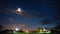 Natural Bold Bright Blue Sky Background. Night Starry Sky With Glowing Stars Above Countryside Landscape. Time Lapse