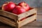 Natural bounty Half apple in rustic wooden crate, copy space