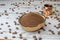 Natural bowl with ground coffee on white wooden table with organic coffee grains and espresso cup