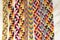 Natural bracelets of friendship, colorful woven friendship bracelets, snow background, rainbow colors, checkered pattern