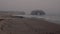 Natural Bridges Rock formation alone in the Pacific on a lonely, desolate day