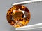 natural brown orange grossular garnet gem on the background